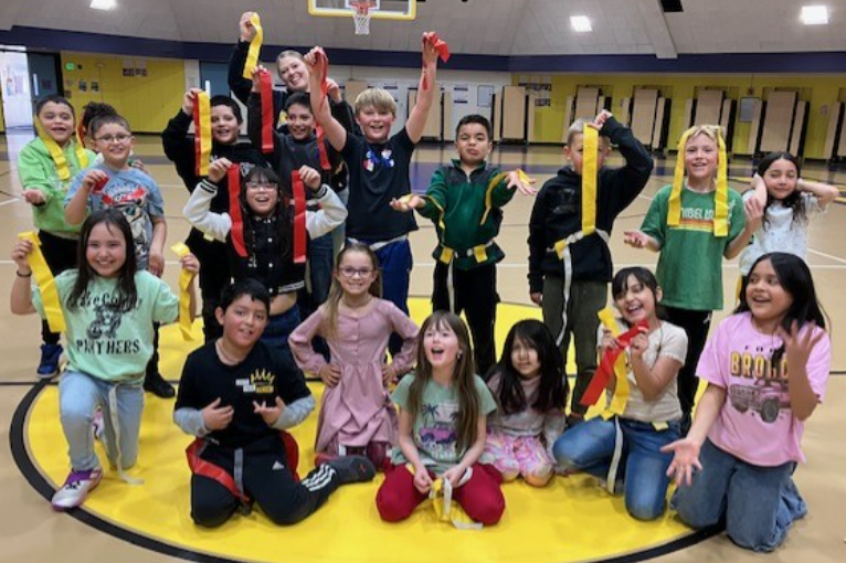 Picture of students playing games for earning the best class attendance,