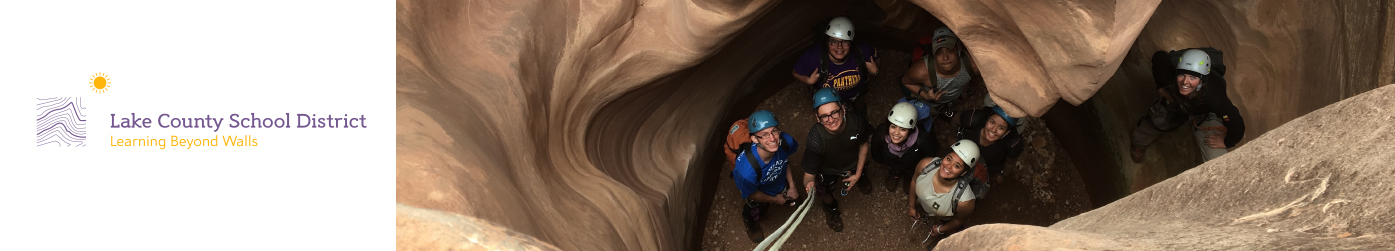 Lake County School District text accompanied by students exploring a cave.