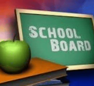 "School Board" text on a Chalk Board next to an apple on a table.