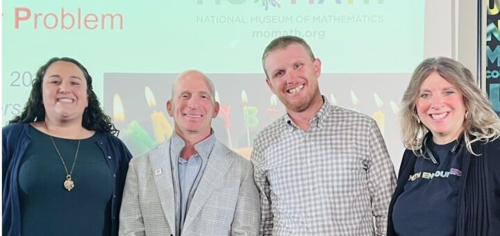 Four teachers posing together for a group photo at the National Museum of Mathematics